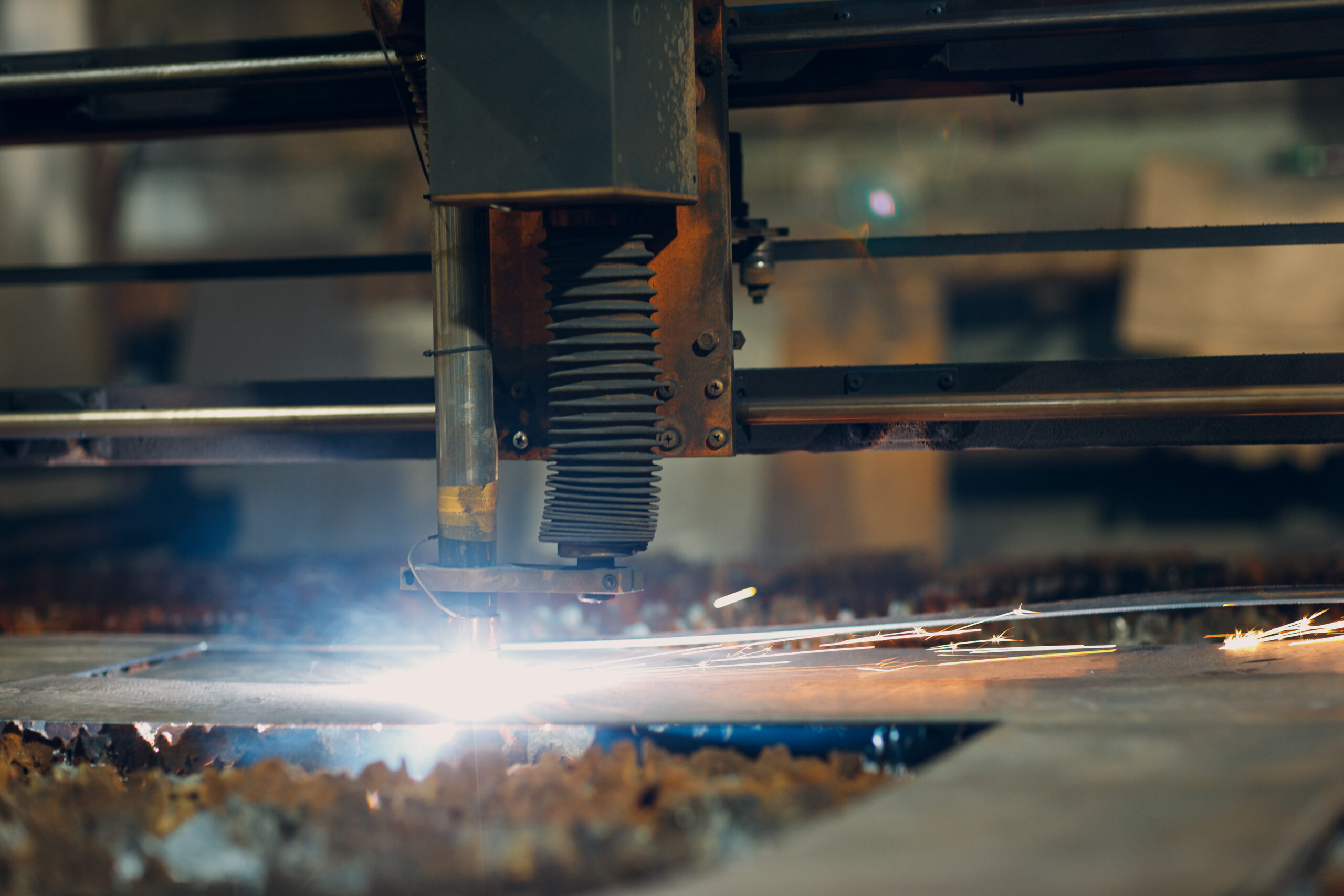 Automatic cnc laser cutting machine working with sheet metal with sparks. Metalworking industrial manufacturing factory